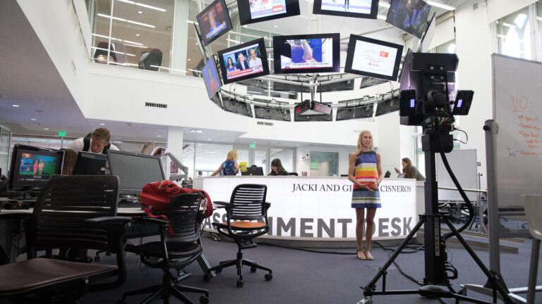 A student recording a news segment at Annenberg School of Journalism.