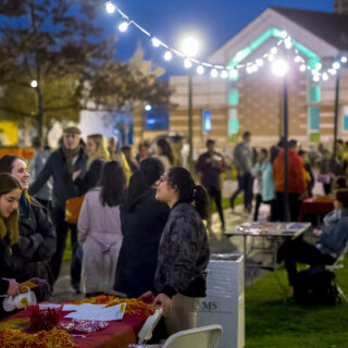 Freshmen talk to student organization representatives during an evening Spring Admit event