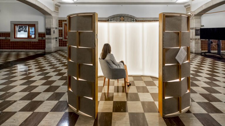 Woman sitting in a peace pod