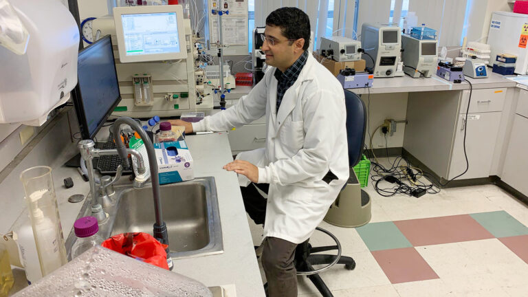 USC researchers in their lab working on a computer