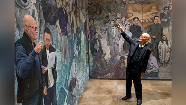 Man looking at a painting