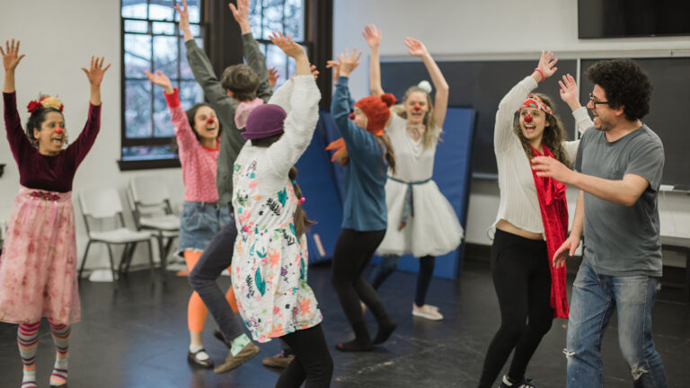 Students in class practicing clown movements