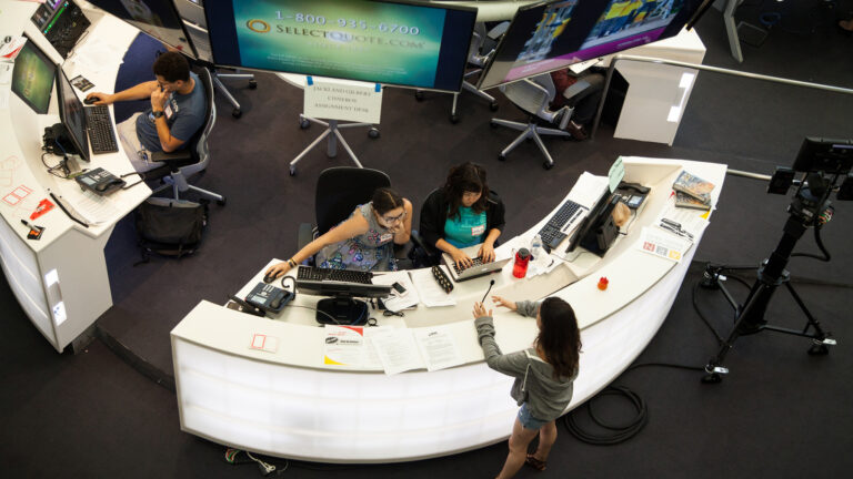 3 students exploring the master control room for Annenberg TV News in Wallis Annenberg Hall