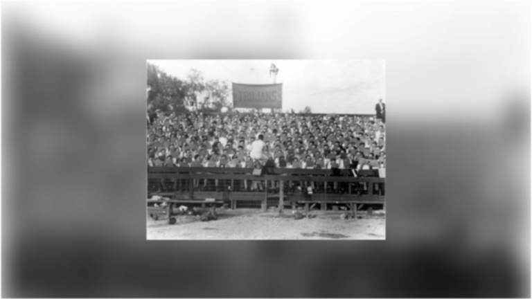 A card stunt attempt in a football crowd on USC's Bovard field