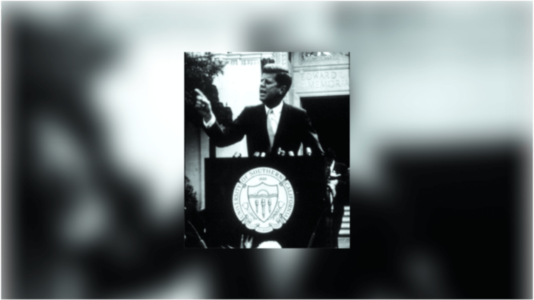 John F. Kennedy speaking from the steps of Doheny Library