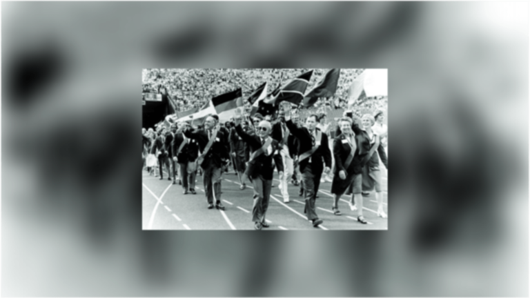 A group of 120 Olympians marching in the LA Memorial Coliseum