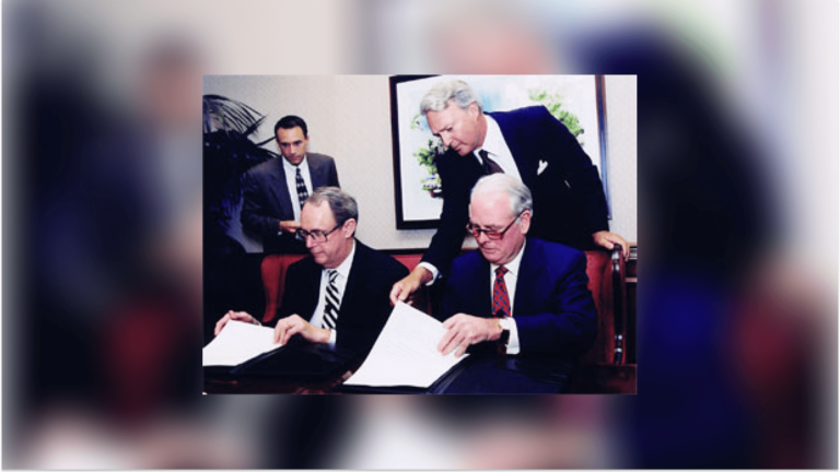 USC general counsel Todd Dickey, USC president Steven B. Sample, W. M. Keck Foundation attorney James P. Lower and foundation chairman and president Robert A. Day signing the Keck School of Medicine agreement.