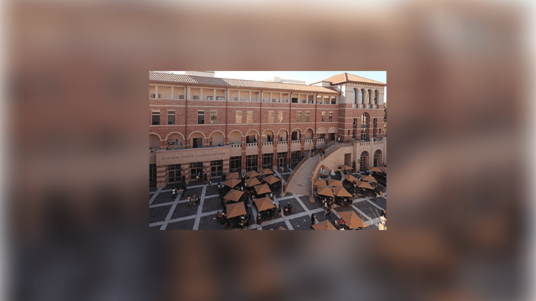 The Ronald Tutor Campus Center - a large, majestic brick building with many windows.
