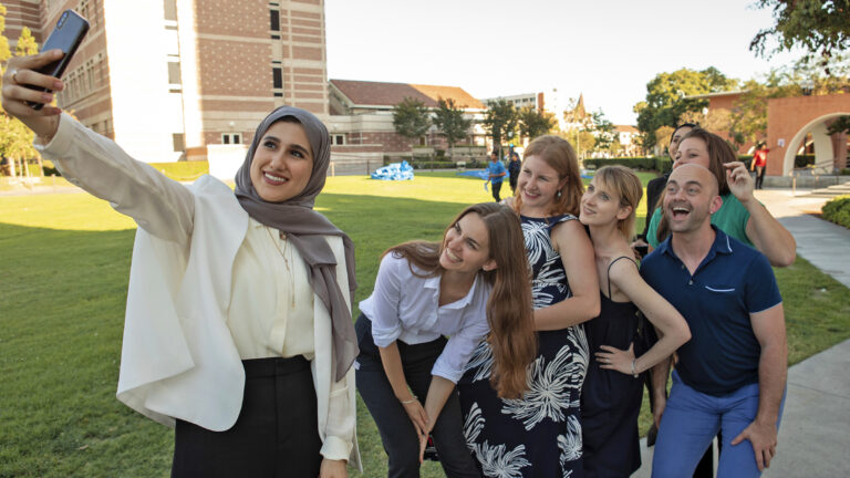 Students taking a selfie on USC's campus during a USC Center on Public Diplomacy summit
