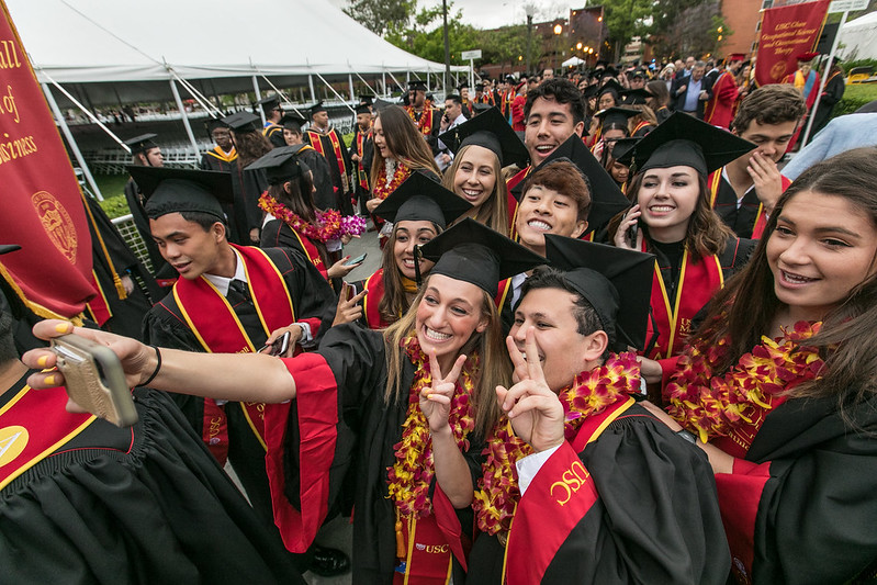USC grads taking a selfie during Commencement