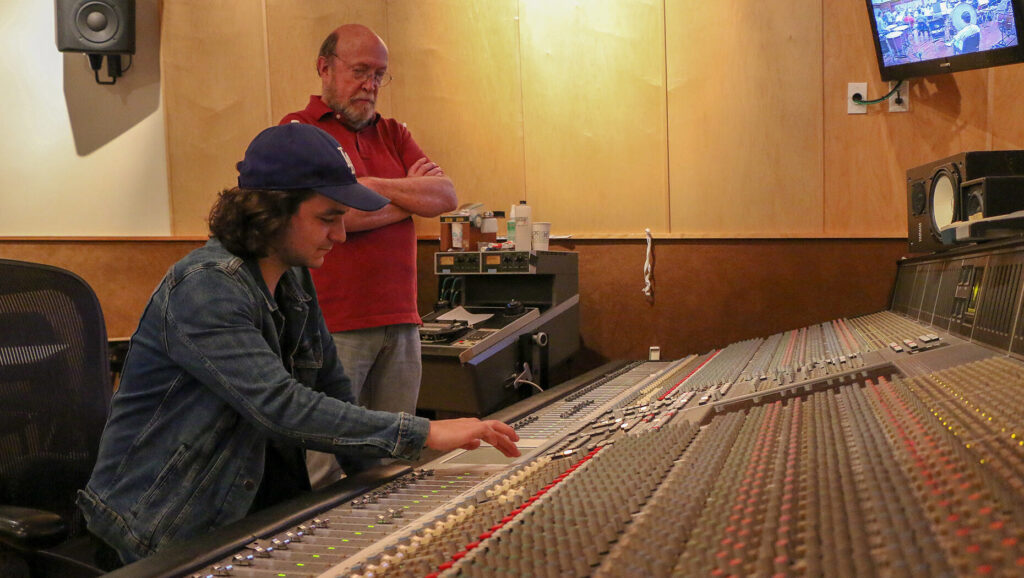 USC Thornton student and professor working in soundboard room