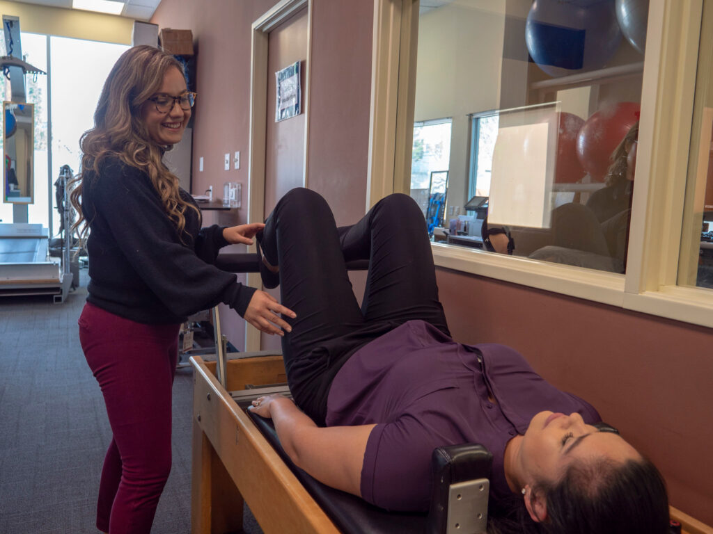 Physical therapy trainer and patient