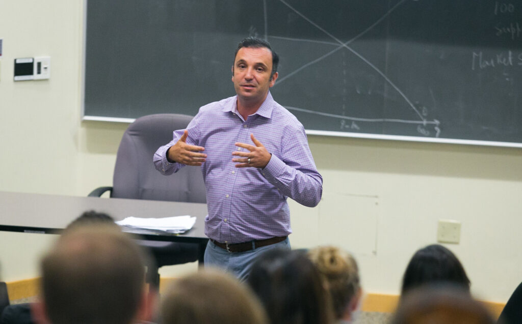 Public policy professor lecturing in front of a group of students