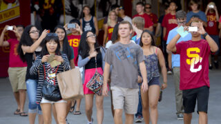 USC students walk through the coliseum tunnel to attend a Welcome Experience Rally