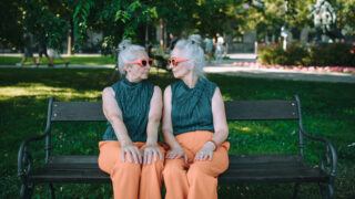 Two older woman who look like twins