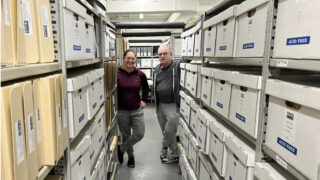ONE Archives curator Alexis Bard Johnson and volunteer Rick Mechtly