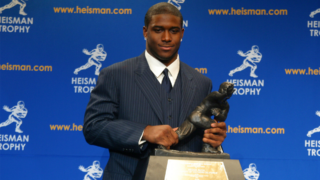 Reggie Bush with Heisman Trophy