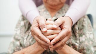 Younger and older person’s hands